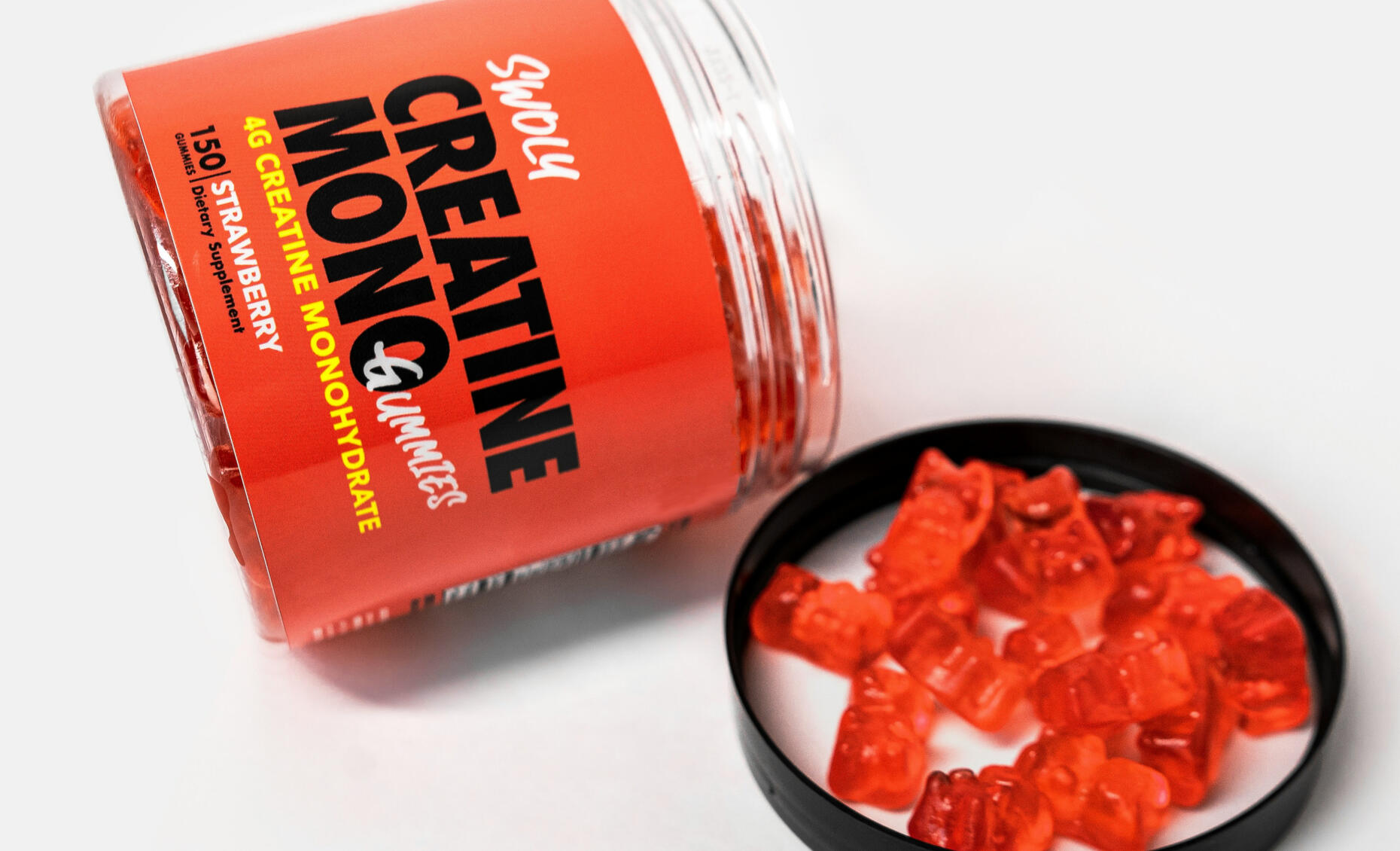 Creatine Gummies Product Jar of creatine monohydrate gummies spilled on lid